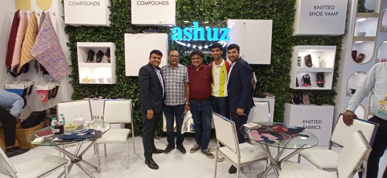 Ashuz booth wall, product displays, and customer meeting area at IIFF 2023 New Delhi