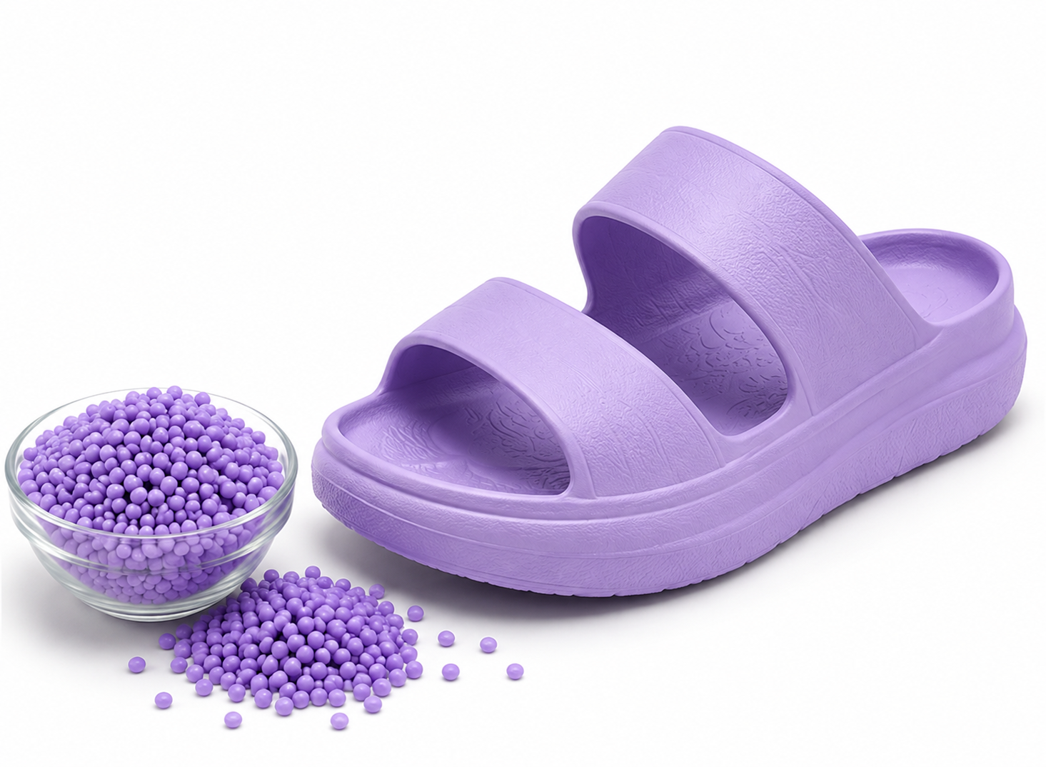 Purple EVA slide with matching compound pellets shown as a lightweight footwear application